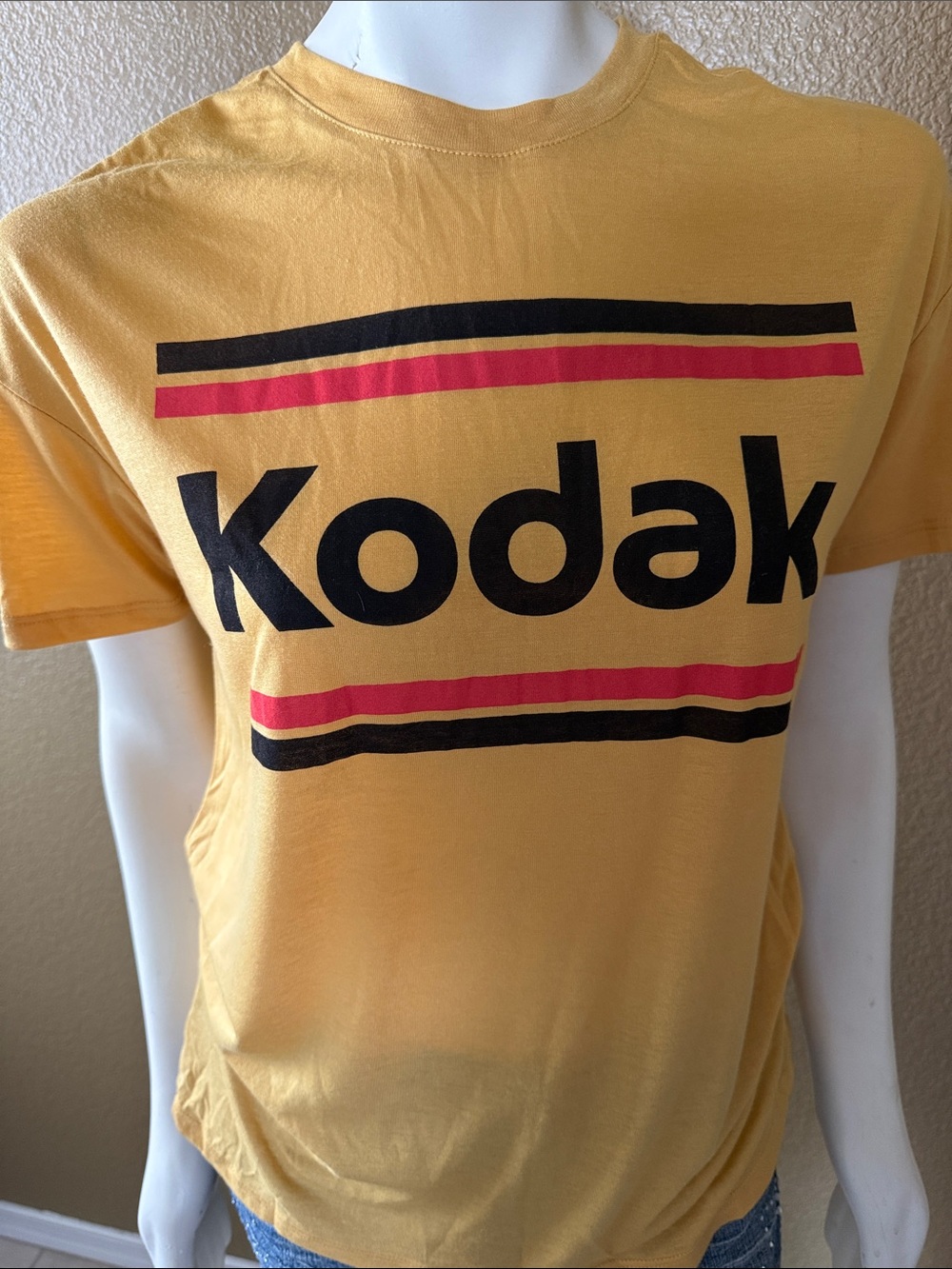 Kodak Yellow Tee with Black Logo and Red Stripes